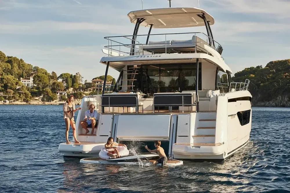 prestige bareboat people on back of boat